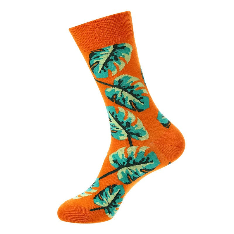 Leaf Crew Socks featuring green tropical leaf design on bright orange background, unisex crew socks