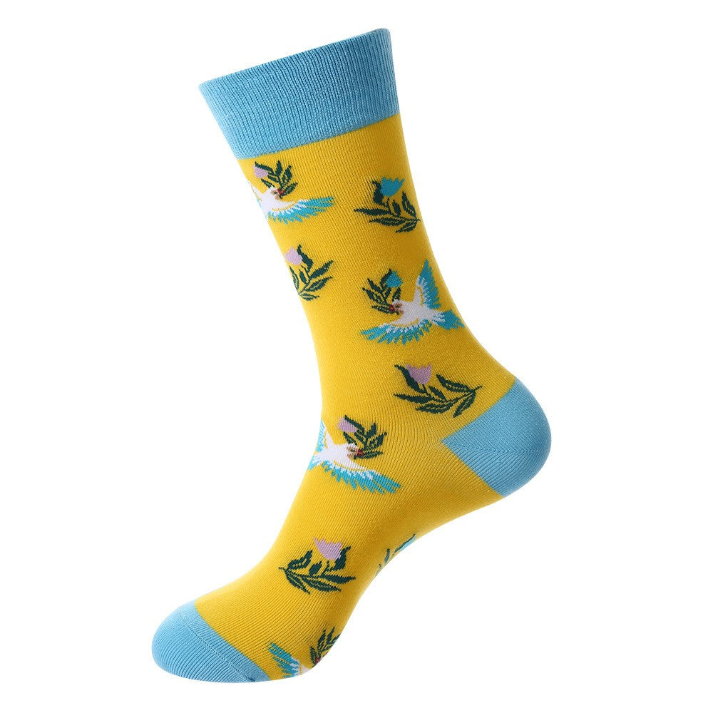 Animal-themed crew socks featuring white and blue flying birds with green leaves and pink flowers on a bright yellow background with blue cuff, heel, and toe accents, unisex socks