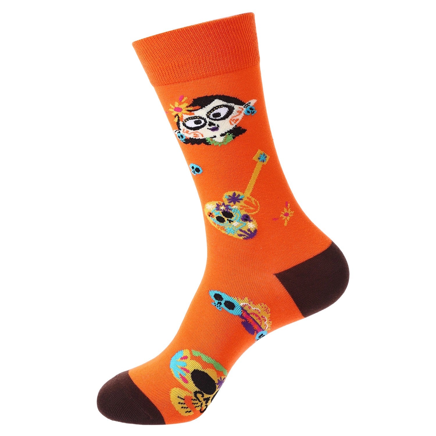 Bright orange crew sock with calavera skulls and a floral-decorated guitar — Day of the Dead inspired.