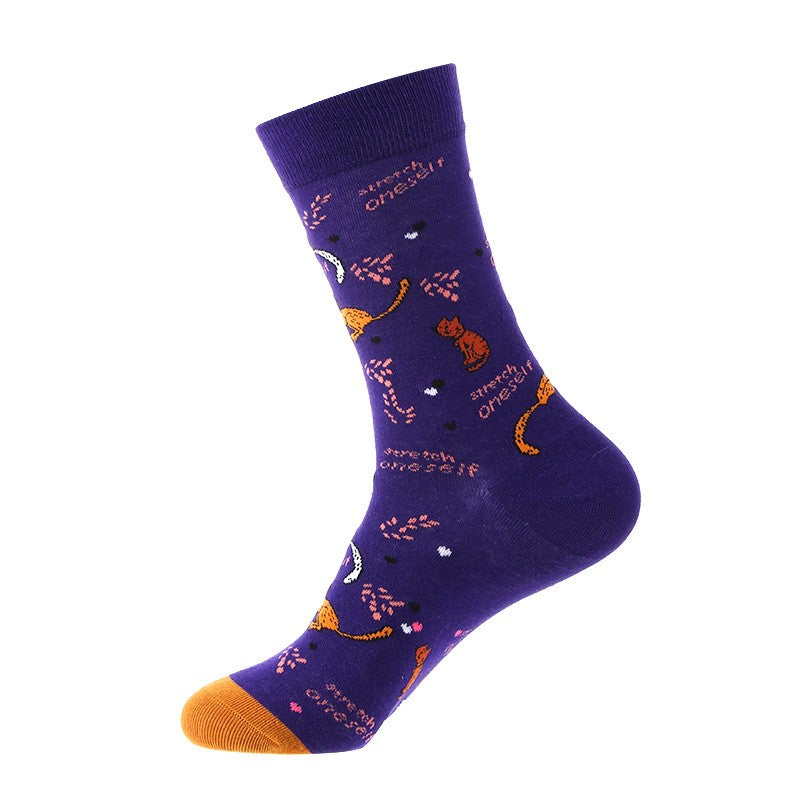 Purple crew sock with stretching orange cats, pink branch accents, and orange toe — animal themed