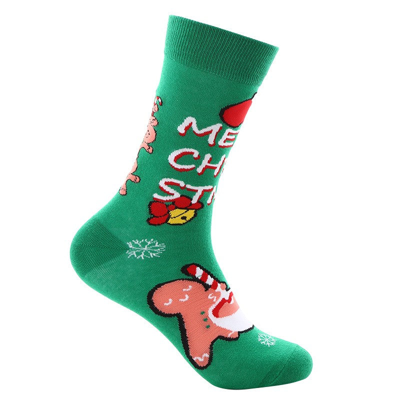 Green crew socks with gingerbread man, candy cane, jingle bells, snowflakes, and Merry Christmas text β unisex holiday socks