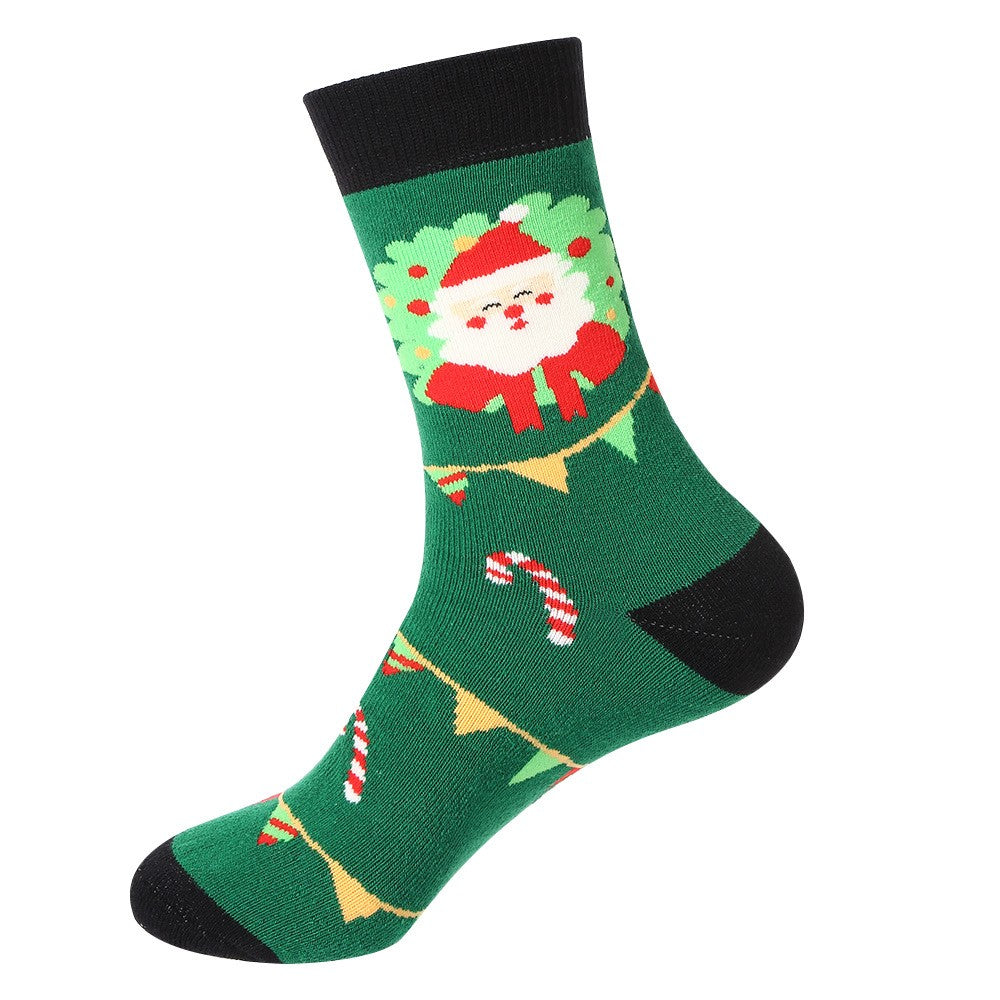 Green Christmas socks with Santa face, candy canes, and holiday garland β unisex festive crew socks