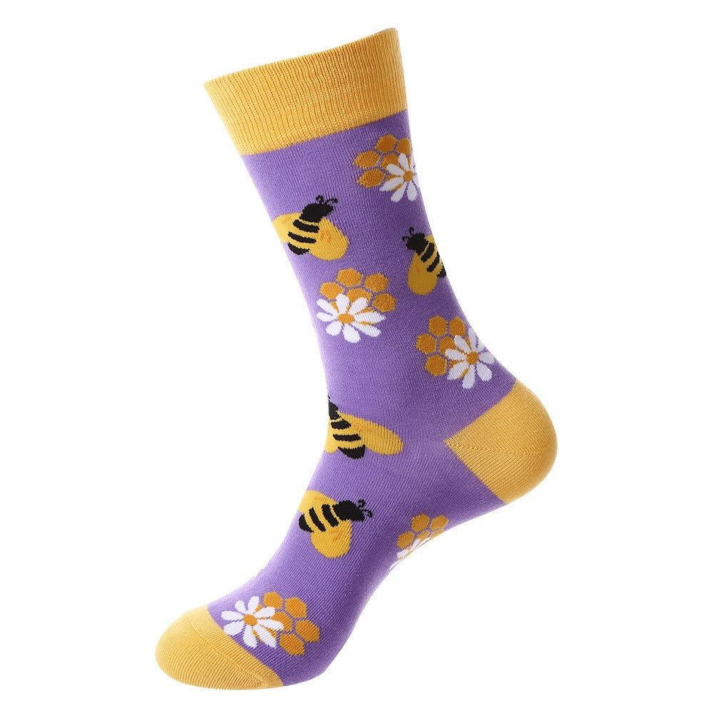 Spring-themed crew socks featuring yellow honey bees, white daisies, and honeycomb patterns on a lavender background with yellow cuff, heel, and toe accents, unisex socks