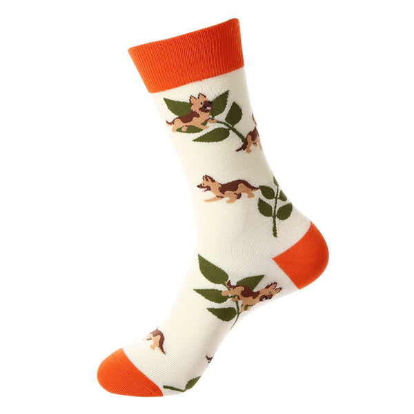 Animal-themed crew socks featuring brown puppies with green leaves on a cream base, orange cuff, heel, and toe accents, unisex socks