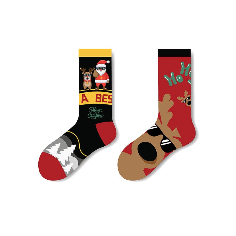 Mismatched Christmas socks with different prints: one with Santa and reindeer scene, one with reindeer face and “Ho Ho Ho” text