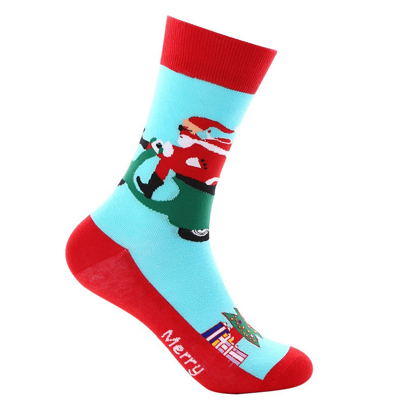 Light blue crew socks with Santa riding a scooter, red toe and heel, presents and tree detail 