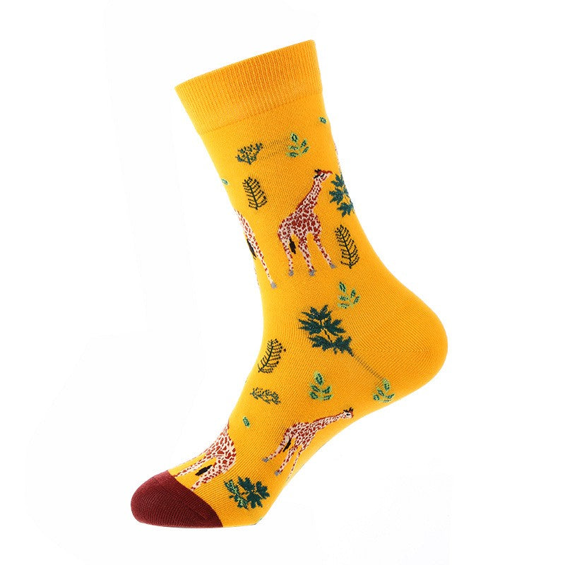 Golden-yellow crew sock with giraffe pattern and green leafy accents, wine-red toe — animal themed